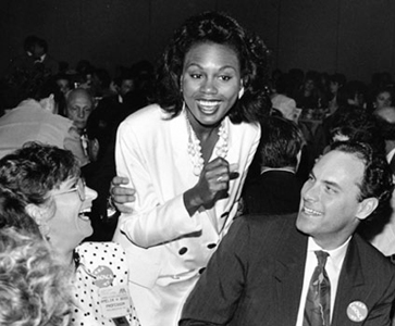 Photo of Anita Hill greeting friends at speech in San Francisco