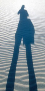 Picture of photographer's shadow across Eureka Dunes, Death Valley, CA.